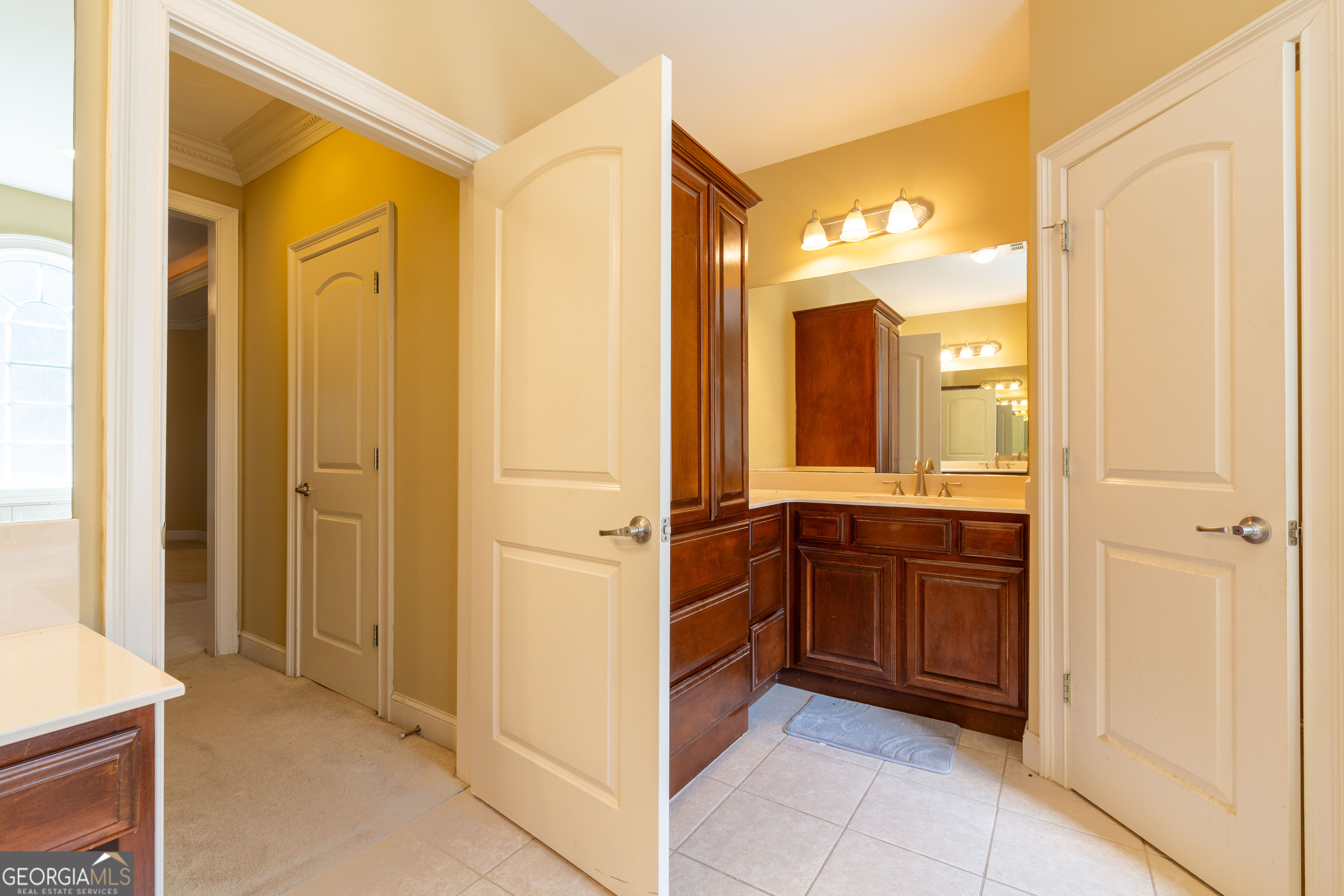 3194 Liverpool Street Jonesboro, GA 30236 - Photo 21 of 44 a spacious bathroom with a mirror a sink and a mirror