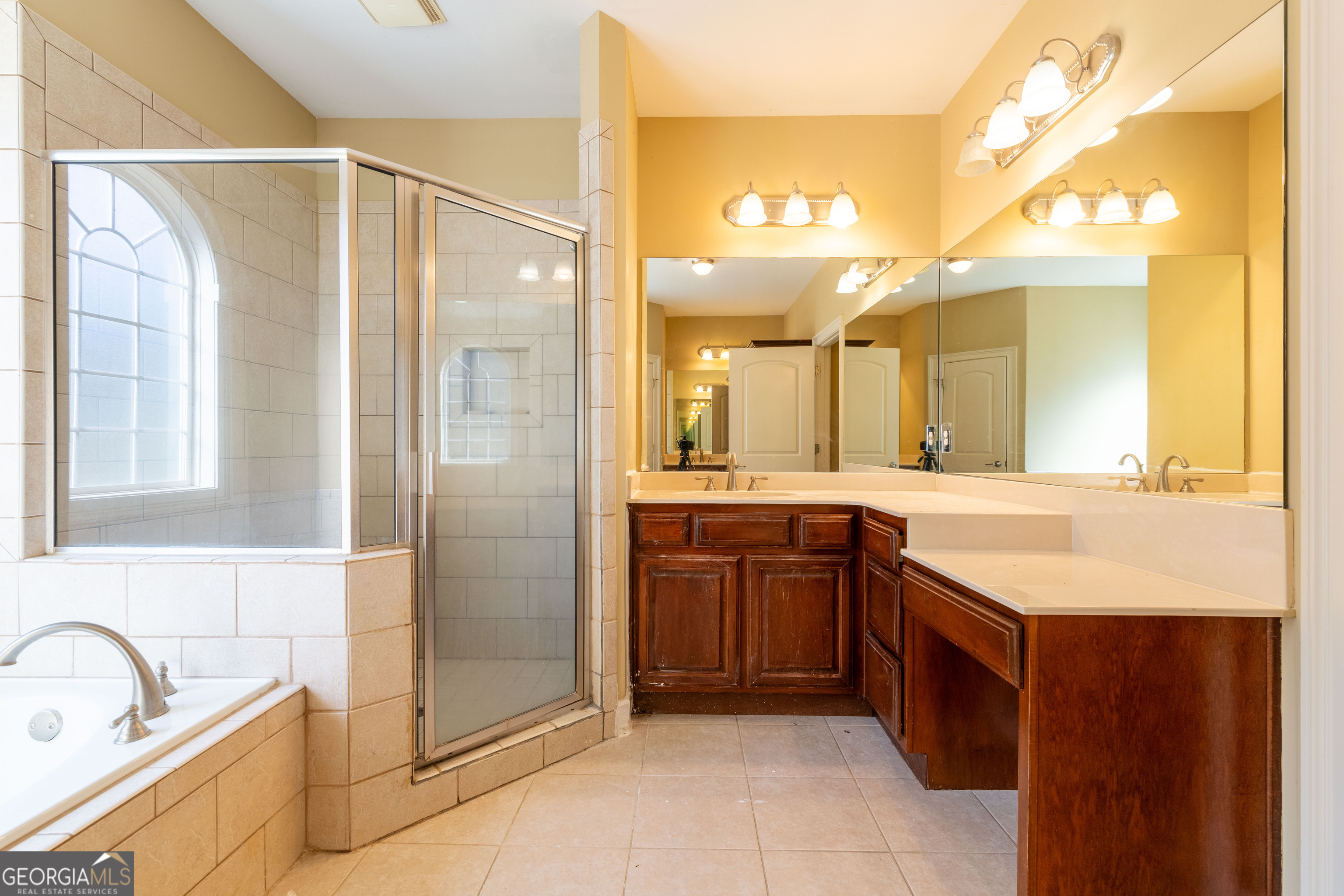 3194 Liverpool Street Jonesboro, GA 30236 - Photo 23 of 44 a bathroom with a granite countertop sink mirror and a bathtub