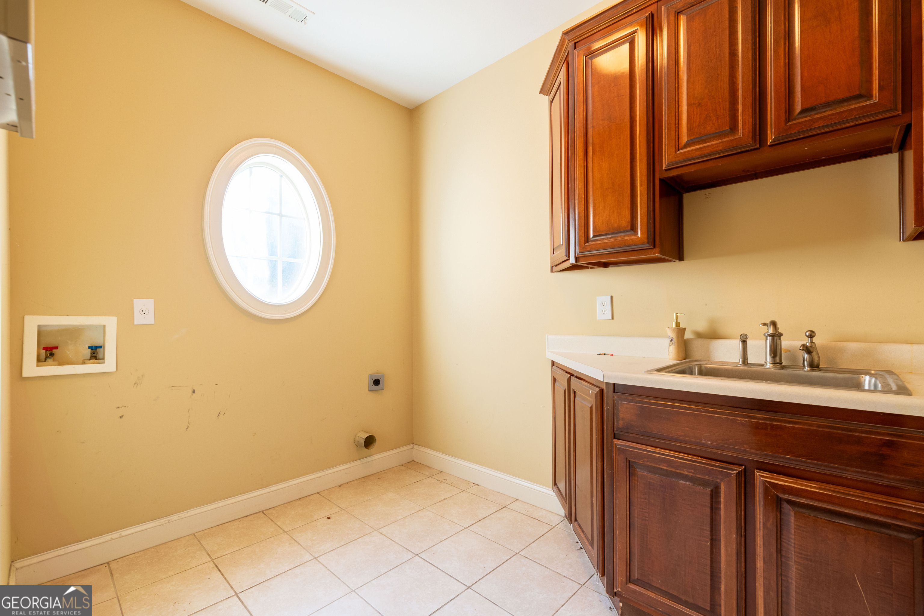 3194 Liverpool Street Jonesboro, GA 30236 - Photo 24 of 44 a bathroom with a sink and a mirror