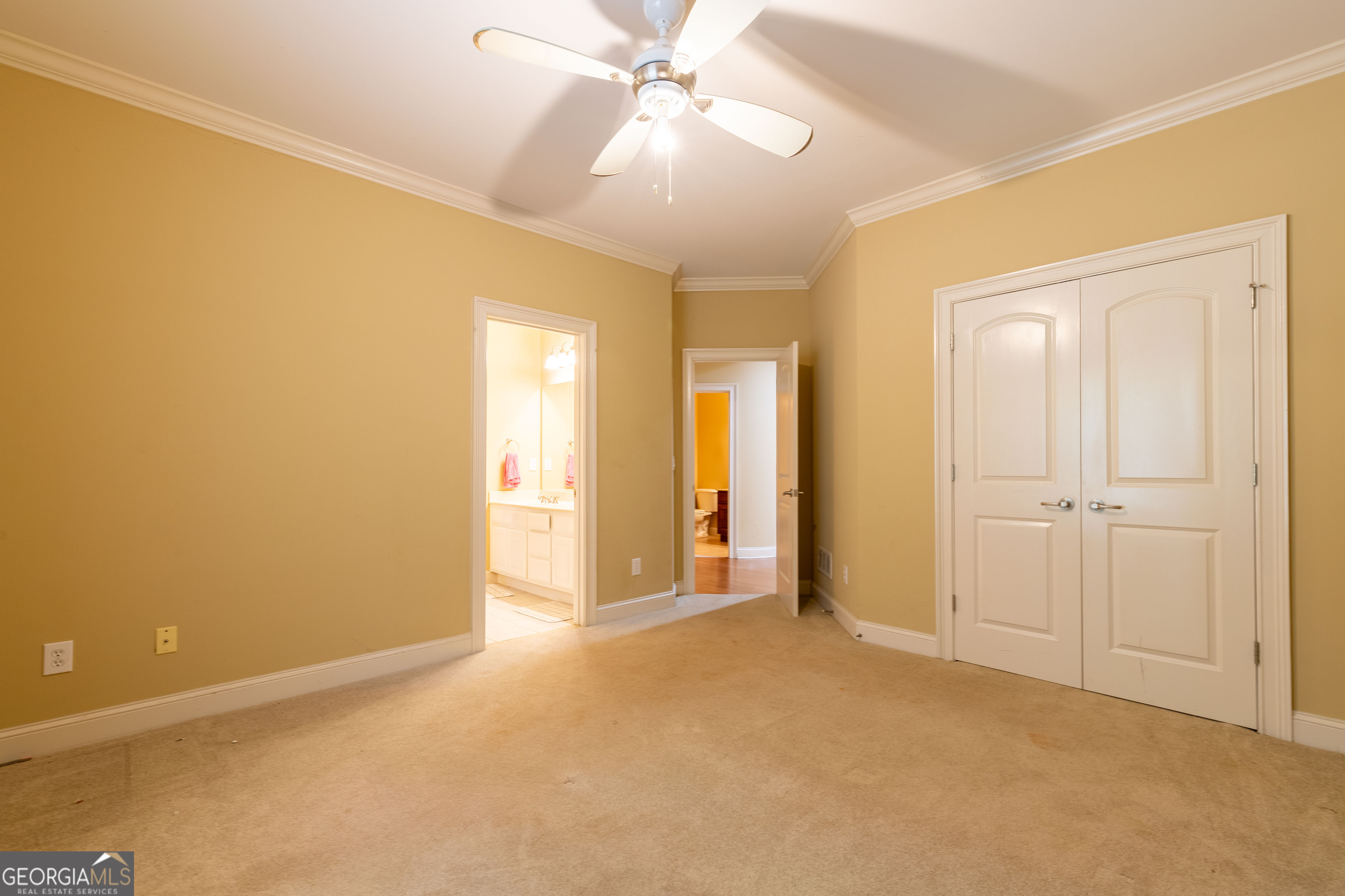 3194 Liverpool Street Jonesboro, GA 30236 - Photo 30 of 44 an empty room with a ceiling fan and closet area