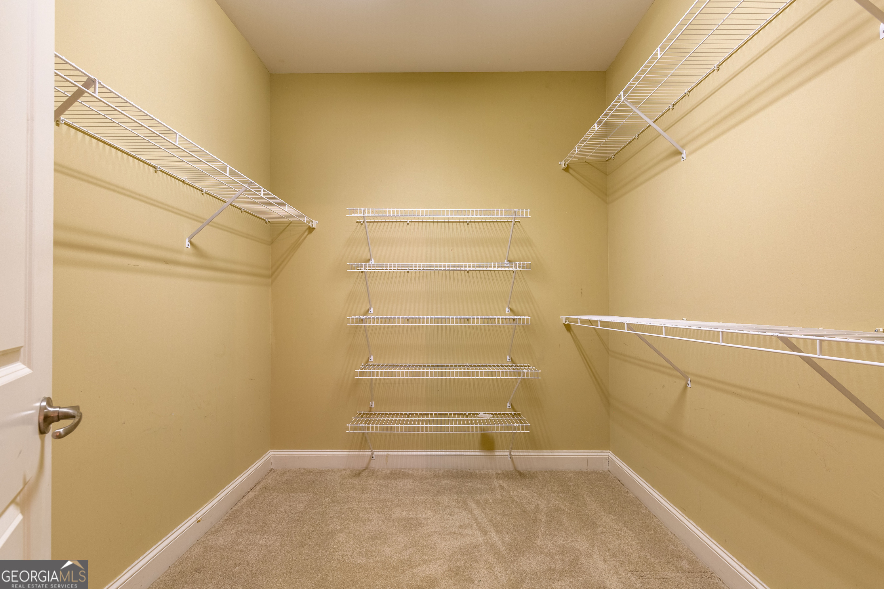 3194 Liverpool Street Jonesboro, GA 30236 - Photo 33 of 44 a view of walk in closet with empty racks