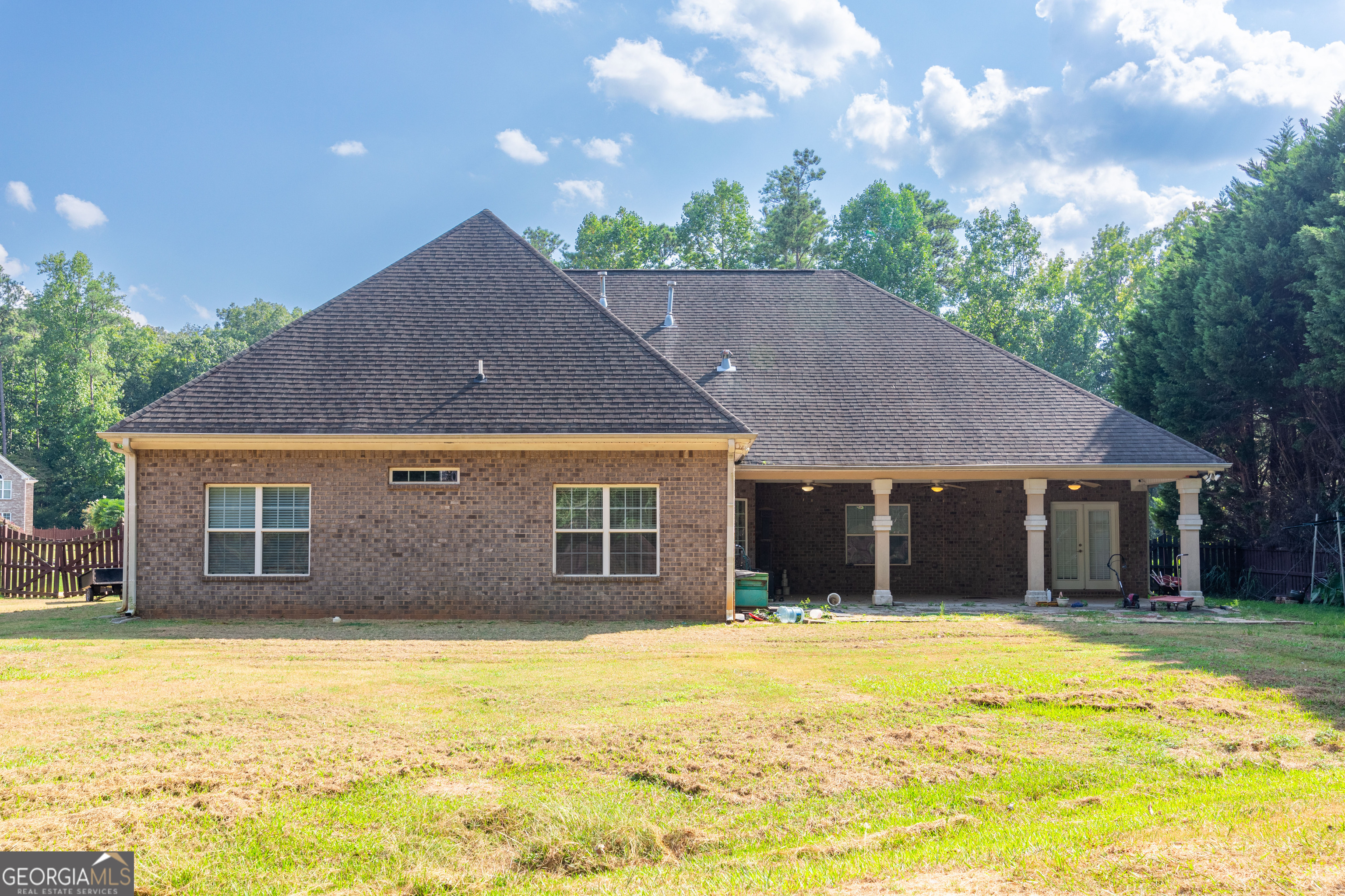 3194 Liverpool Street Jonesboro, GA 30236 - Photo 40 of 44 a house view with a swimming pool