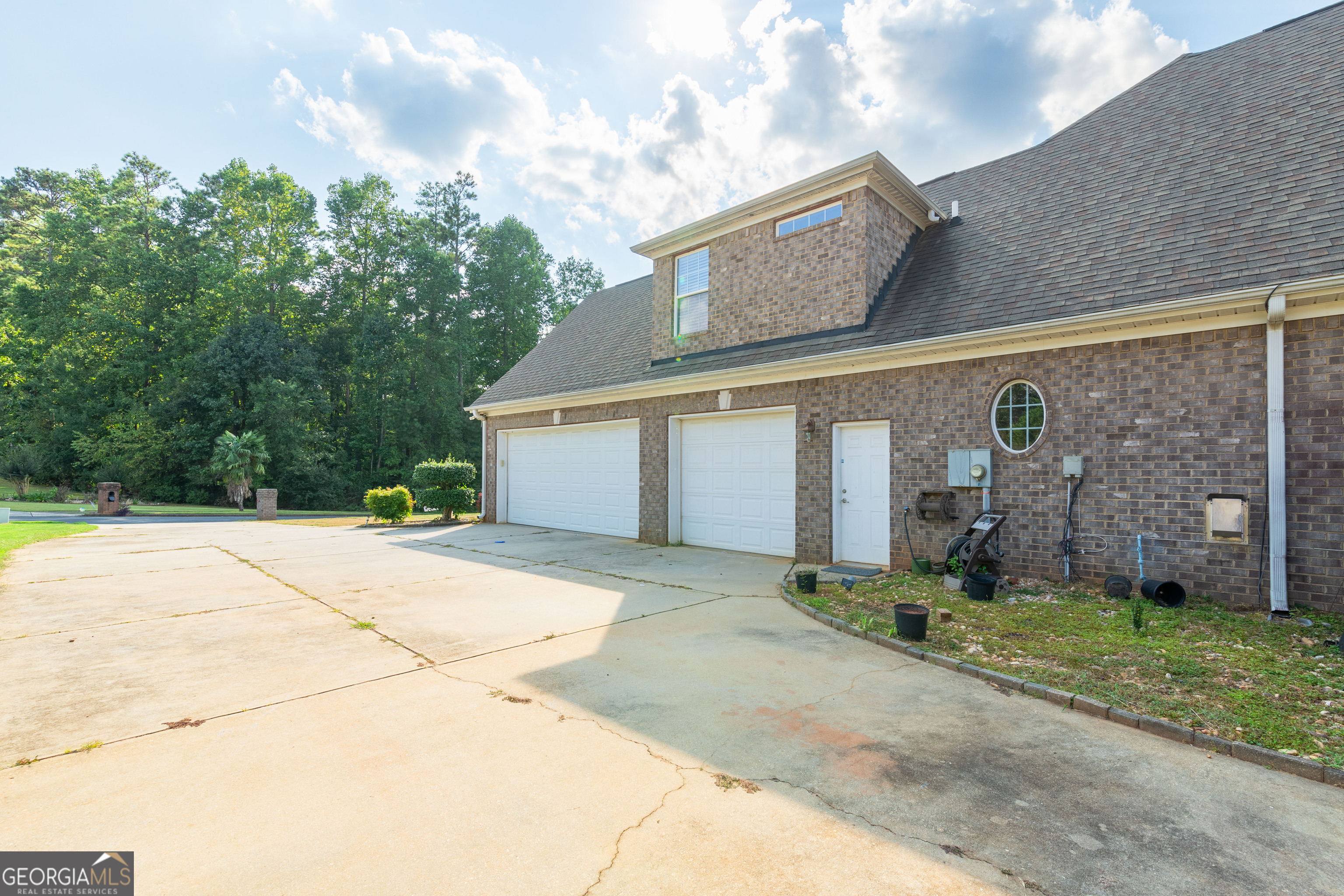 3194 Liverpool Street Jonesboro, GA 30236 - Photo 4 of 44 a front view of a house with a yard and garage