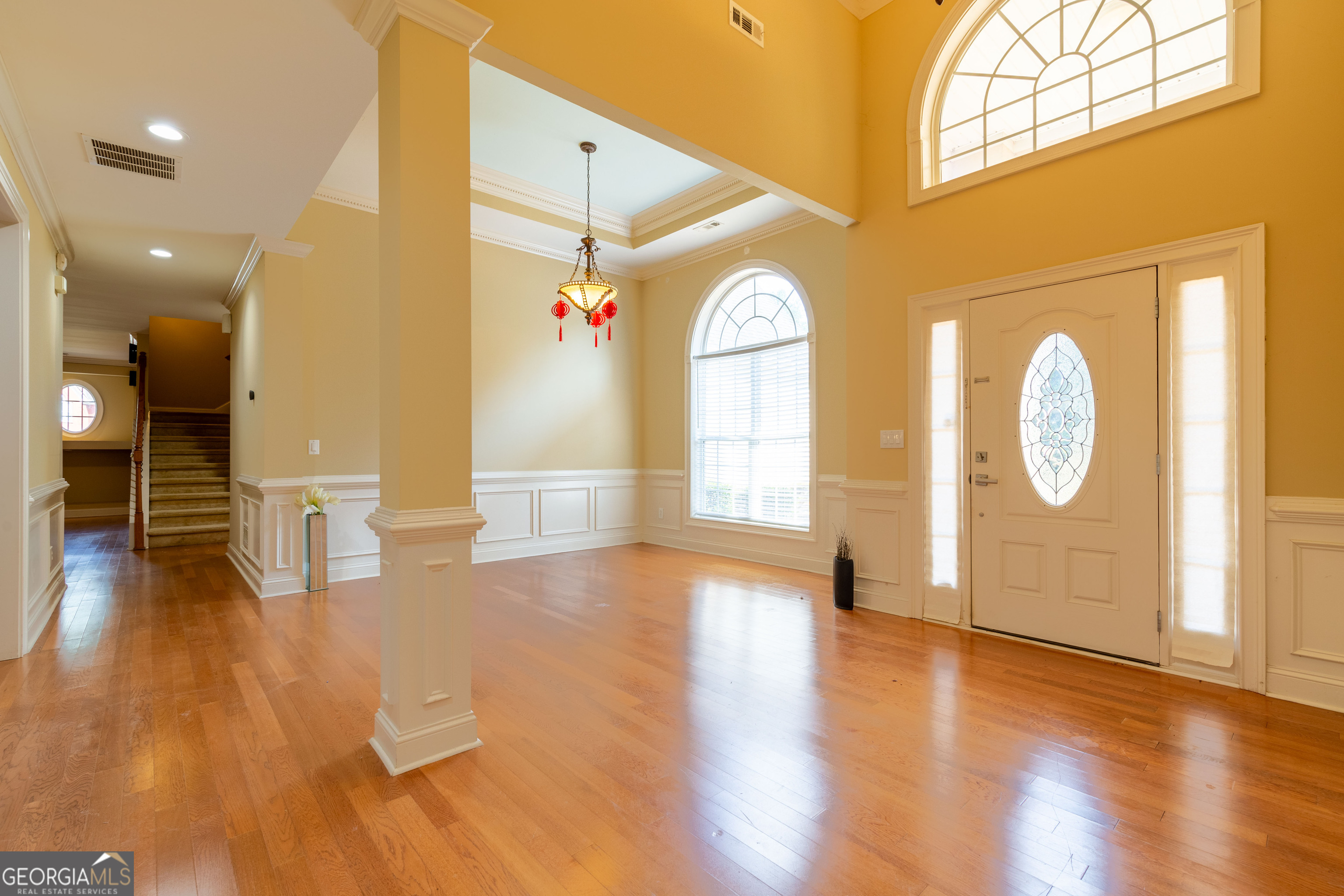 3194 Liverpool Street Jonesboro, GA 30236 - Photo 6 of 44 an empty room with wooden floor and windows
