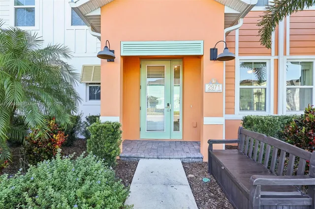 a view of a house with porch and wooden floor