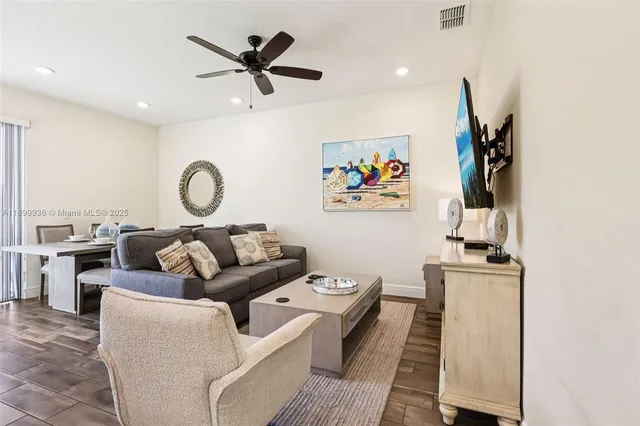 a living room with furniture and window