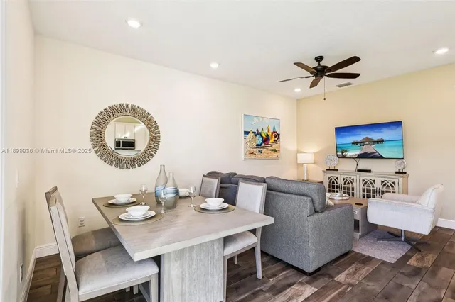 a living room with furniture and a mirror