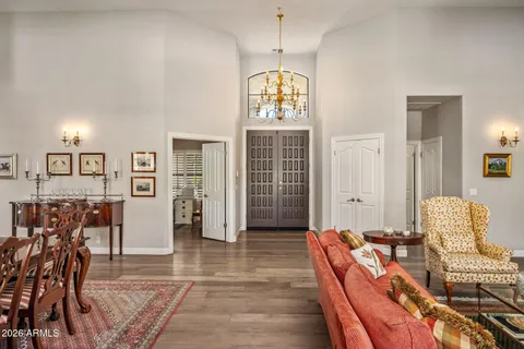 a living room with furniture a dining table and chairs