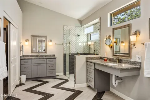 a bathroom with a granite countertop sink mirror and a