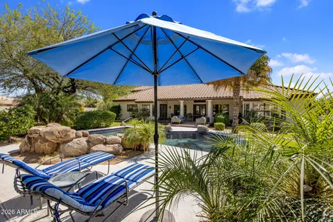 a view of an chairs and table in the patio