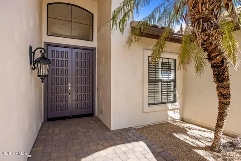a view of a door and a window