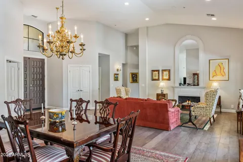 a view of a a dining room with furniture window and wooden floor