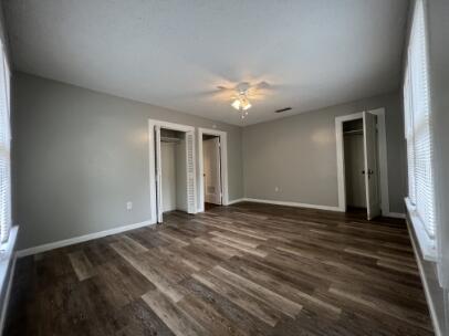 2318 18th Street Lubbock, TX 79401 - Photo 12 of 21 a view of an empty room with window and a ceiling fan