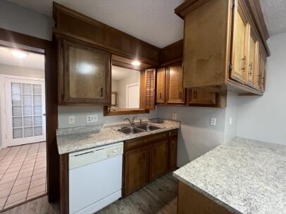 2318 18th Street Lubbock, TX 79401 - Photo 15 of 21 a kitchen with a sink stove and cabinets