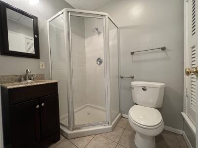 2318 18th Street Lubbock, TX 79401 - Photo 17 of 21 a bathroom with a toilet sink and shower