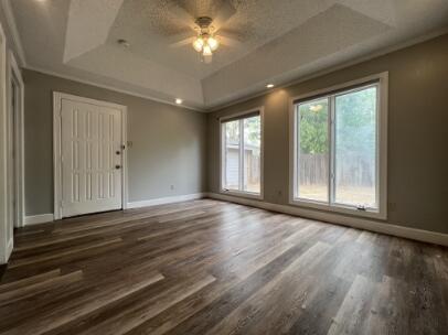 2318 18th Street Lubbock, TX 79401 - Photo 19 of 21 a view of an empty room with wooden floor and a window