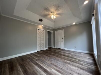 2318 18th Street Lubbock, TX 79401 - Photo 20 of 21 a view of a livingroom with a ceiling fan and window