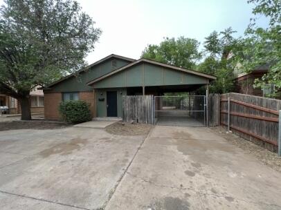 2318 18th Street Lubbock, TX 79401 - Photo 2 of 21 a view of a house with backyard and trees