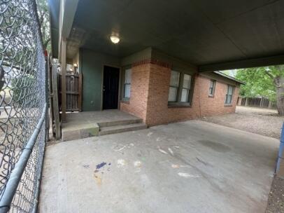 2318 18th Street Lubbock, TX 79401 - Photo 3 of 21 a view of a house with backyard and tree