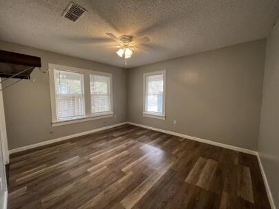2318 18th Street Lubbock, TX 79401 - Photo 7 of 21 a view of an empty room with a window