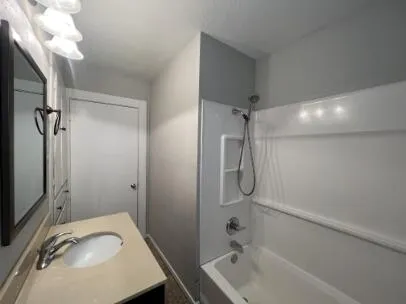 a bathroom with a sink toilet and mirror
