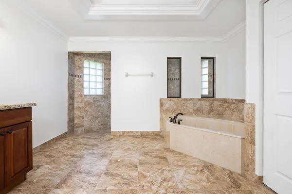 a white bath tub sitting in a bathroom