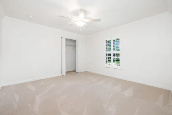 a utility room with cabinets washer and dryer