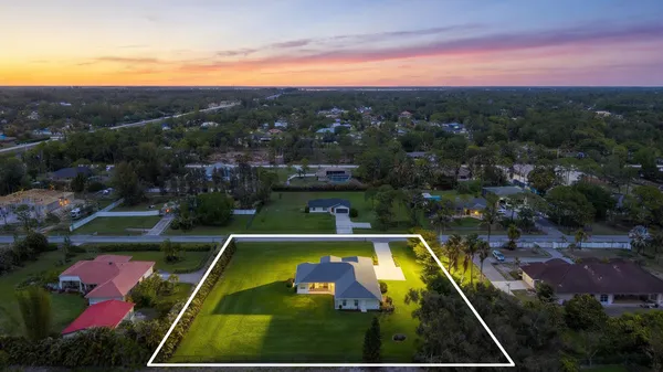 a view of a house with a big yard