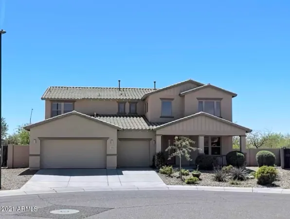 a front view of a house with yard
