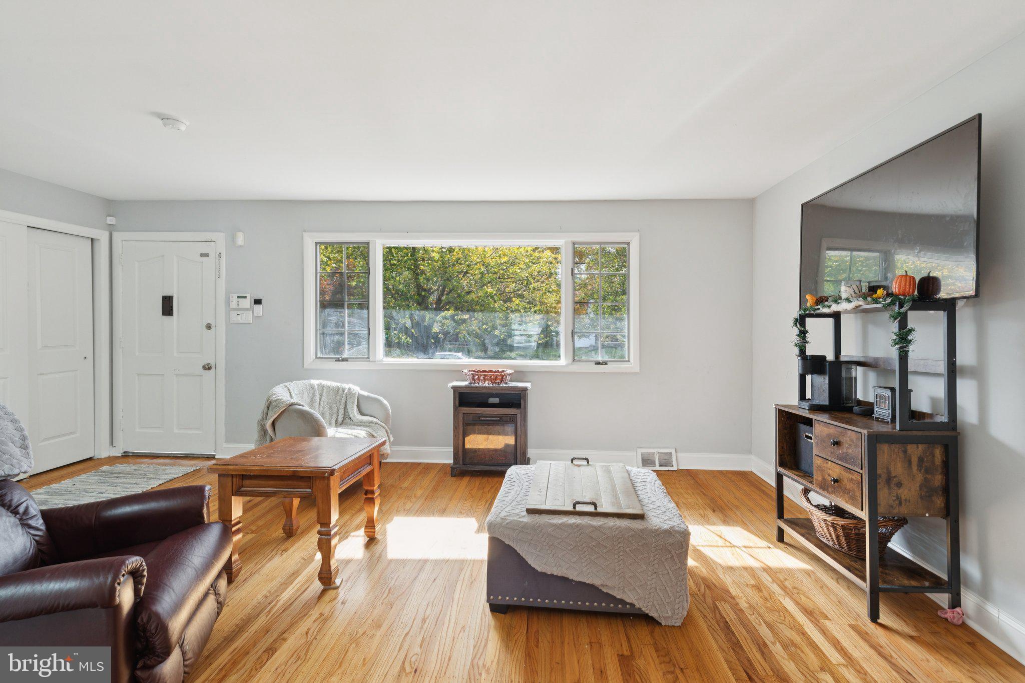 407 Yorkshire Road Cherry Hill, NJ 08034 - Photo 11 of 62 a living room with furniture and a flat screen tv