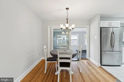 a view of an entryway with wooden floor