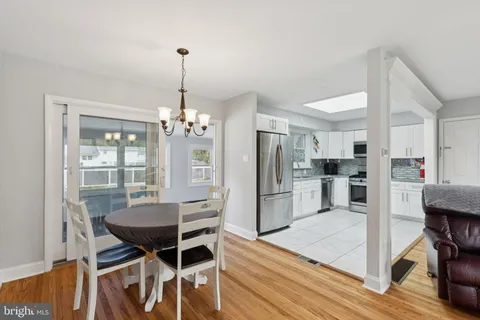 a kitchen with stainless steel appliances a refrigerator sink and microwave