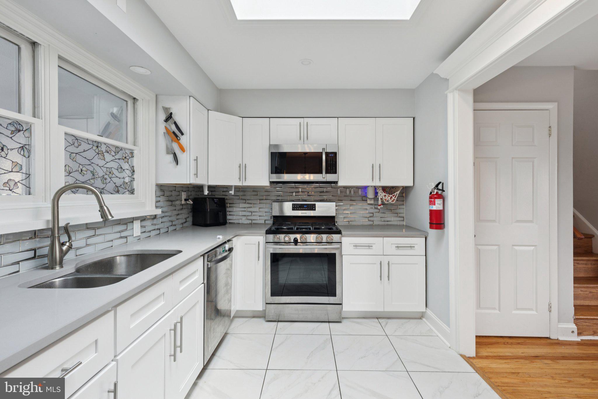 407 Yorkshire Road Cherry Hill, NJ 08034 - Photo 20 of 62 a kitchen with cabinets a sink and appliances