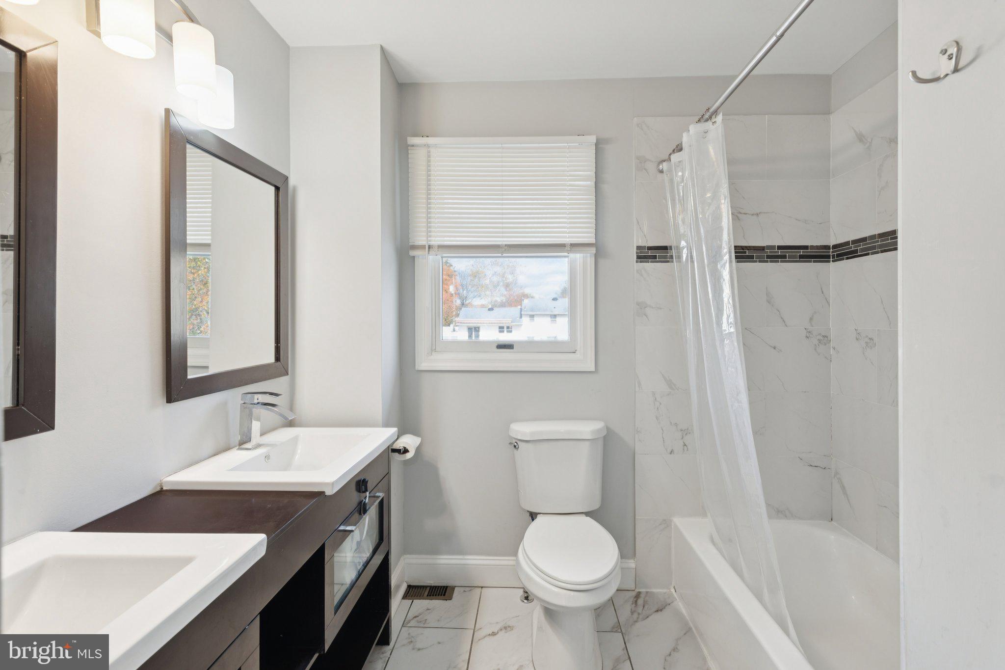 407 Yorkshire Road Cherry Hill, NJ 08034 - Photo 25 of 62 a bathroom with a sink toilet and shower