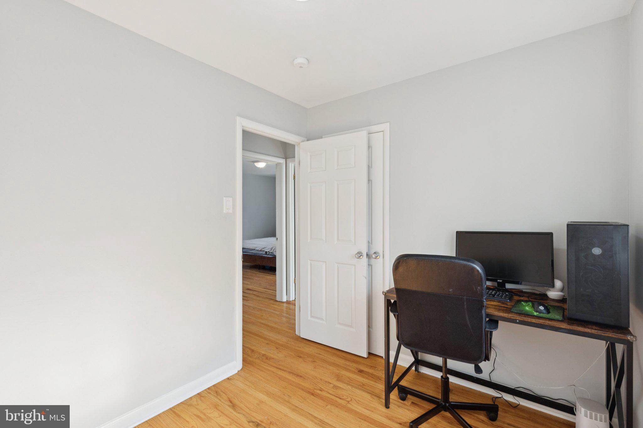 407 Yorkshire Road Cherry Hill, NJ 08034 - Photo 28 of 62 a view of a workspace with furniture and wooden floor