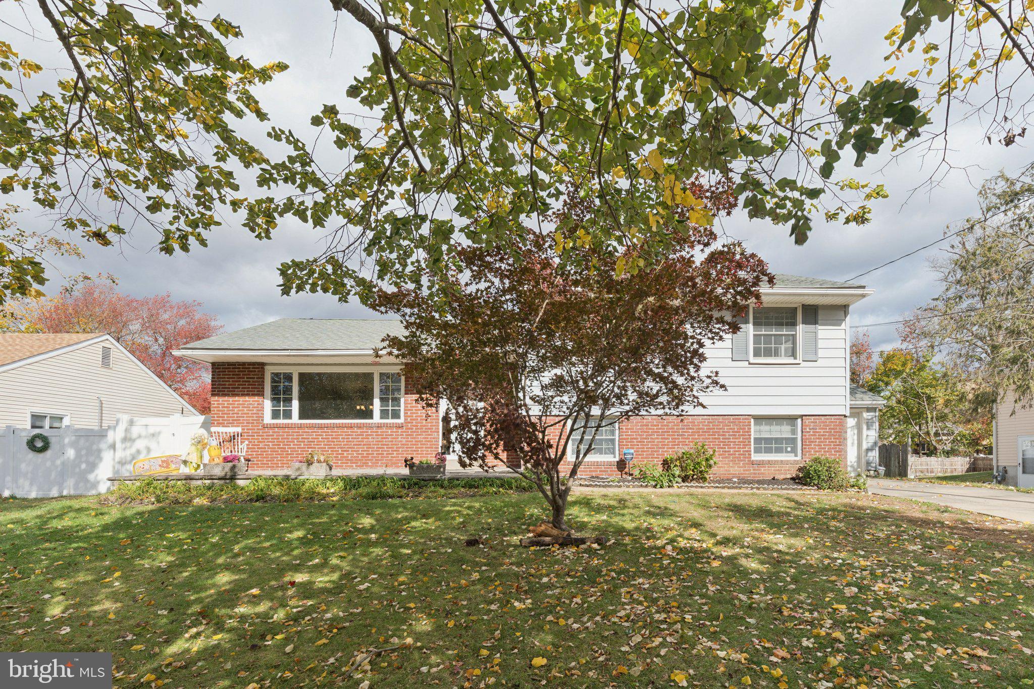 407 Yorkshire Road Cherry Hill, NJ 08034 - Photo 3 of 62 a front view of a house with a garden