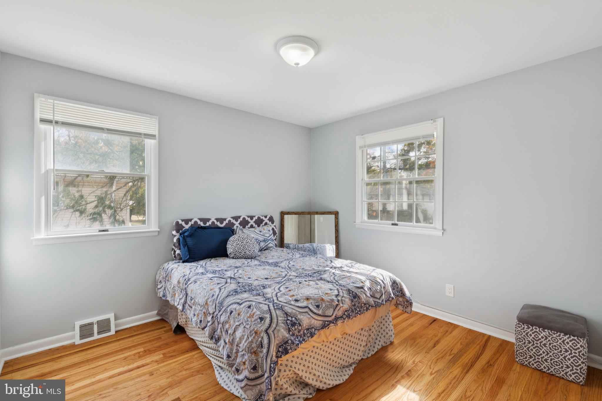 407 Yorkshire Road Cherry Hill, NJ 08034 - Photo 33 of 62 a bedroom with a large bed and a window