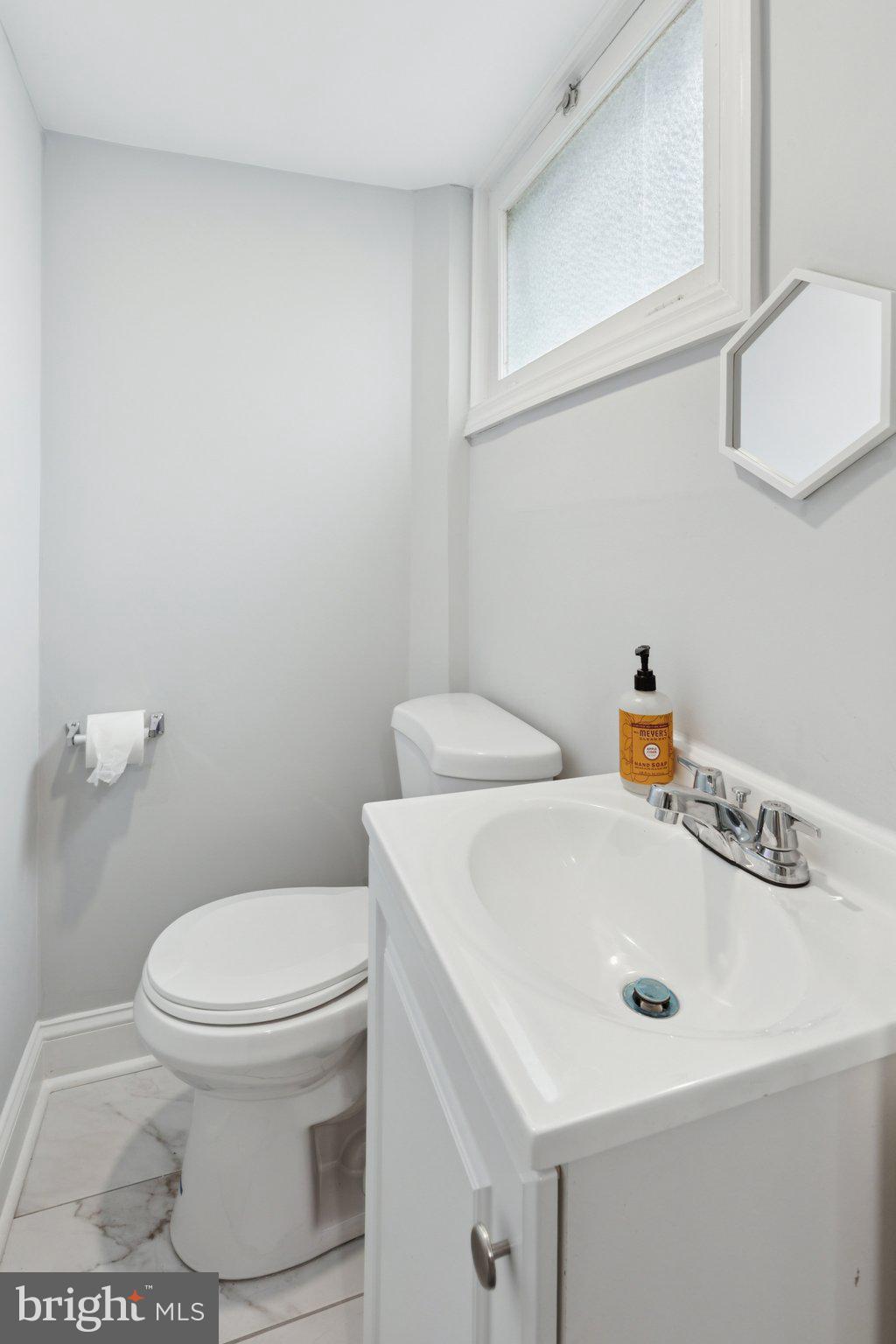 407 Yorkshire Road Cherry Hill, NJ 08034 - Photo 38 of 62 a bathroom with a sink a toilet and mirror