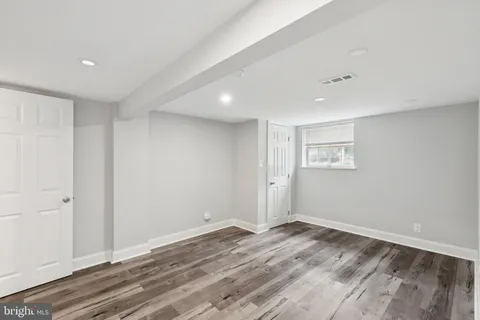 a view of a swimming pool with a patio and a yard