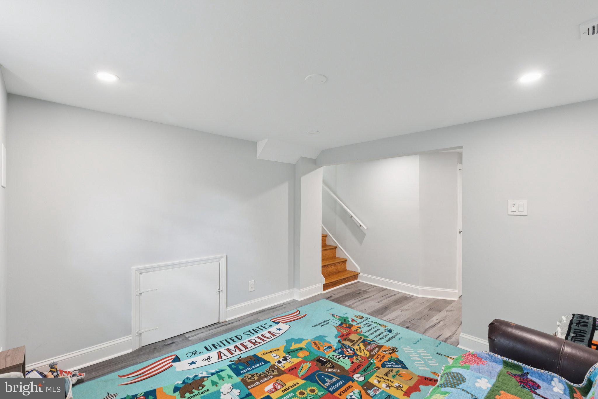 407 Yorkshire Road Cherry Hill, NJ 08034 - Photo 46 of 62 a view of an empty room and wooden floor