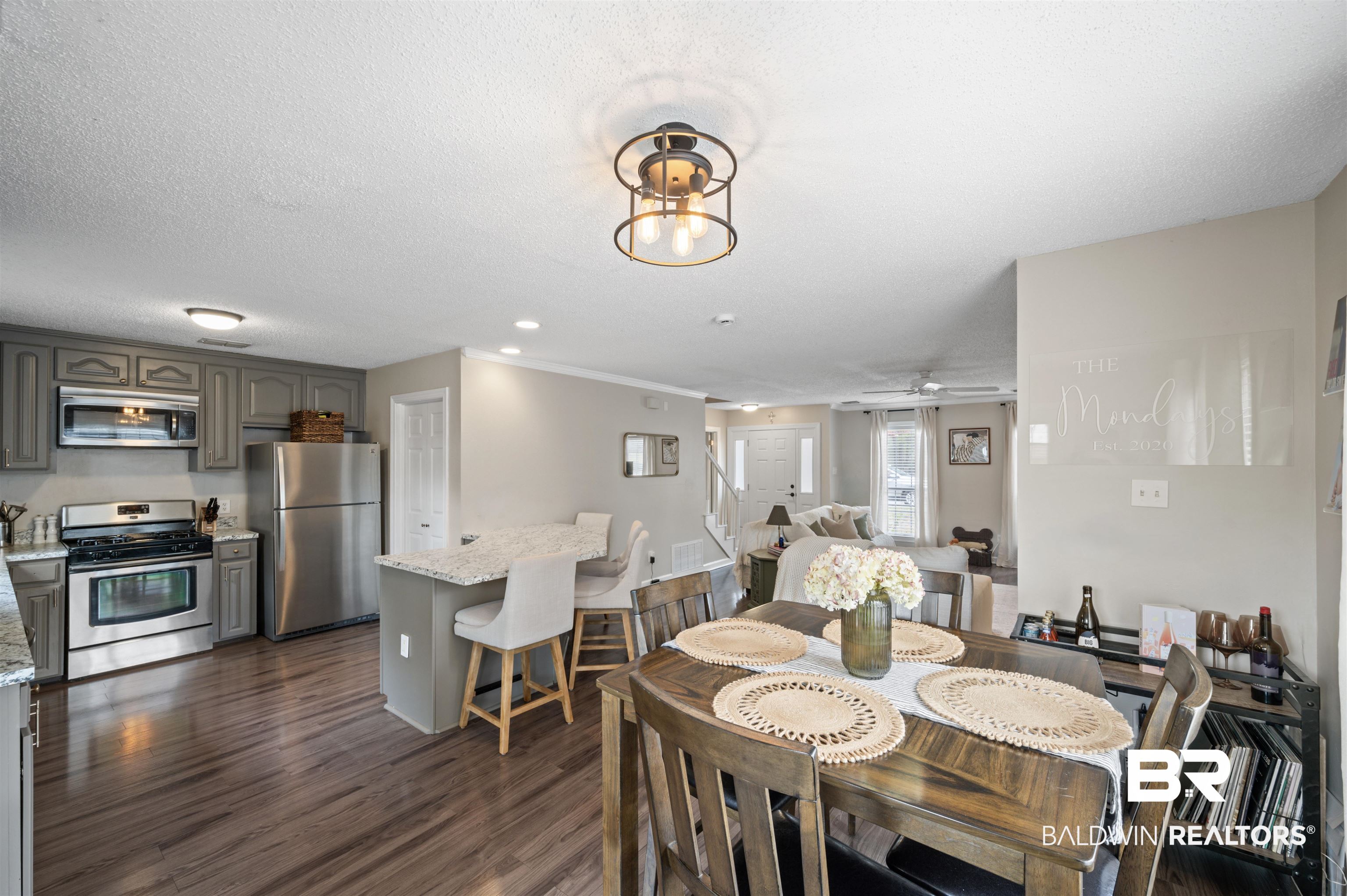 1066 Linlen Avenue Mobile, AL 36609 - Photo 10 of 22 Dining room with a ceiling fan, recessed lighting, dark wood-type flooring, and a textured ceiling
