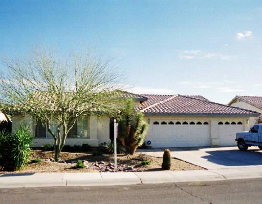 a front view of a house with garage