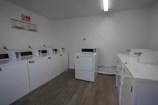 an aerial view of a house with a garden and swimming pool