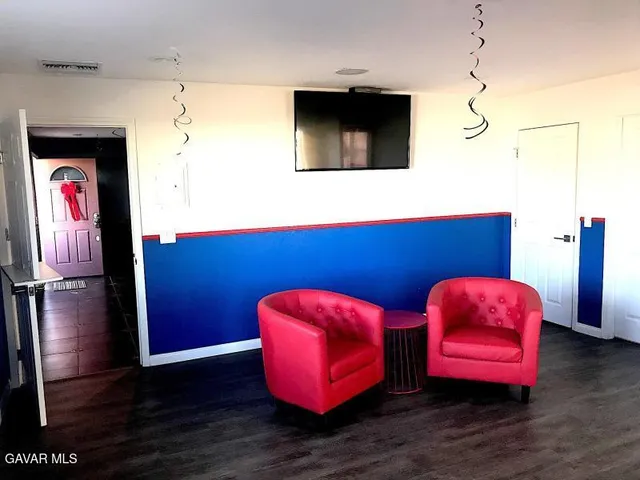 a view of lobby with furniture and wooden floor