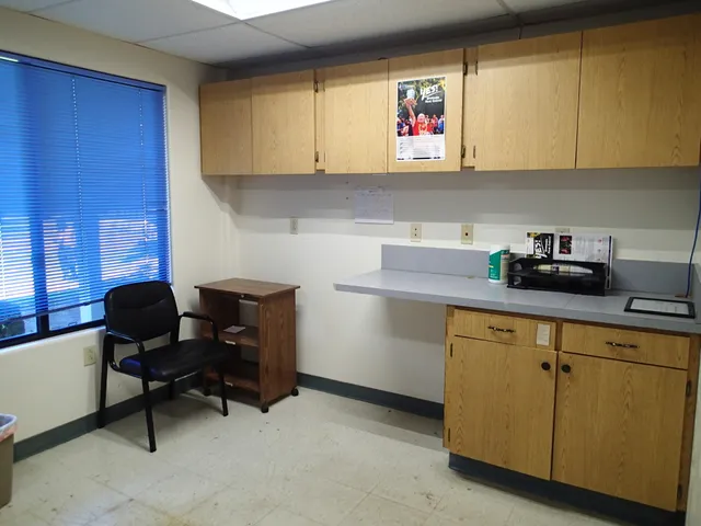 a room with cabinets and window