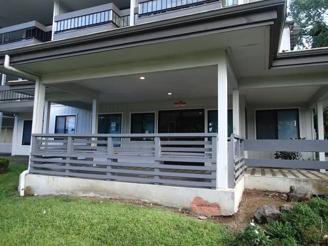 a view of a lake with a house in the background