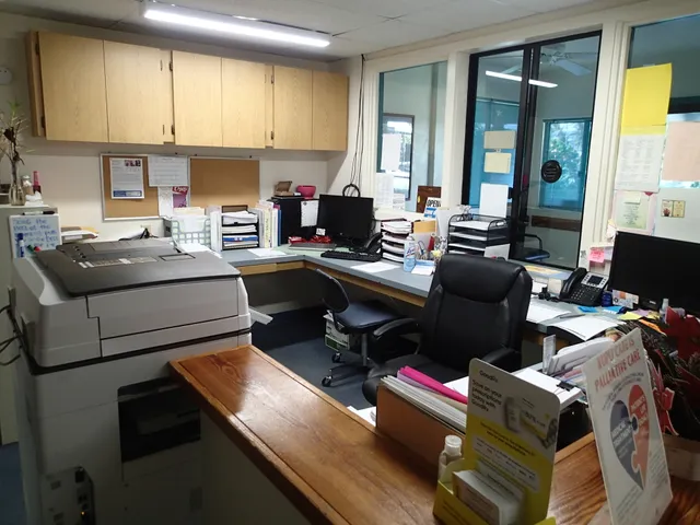 a kitchen with a refrigerator and a stove top oven