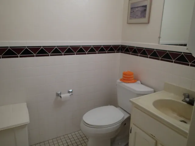 a view of a workspace with furniture and a chair