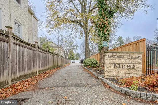 a view of a pathway with a backyard of the house