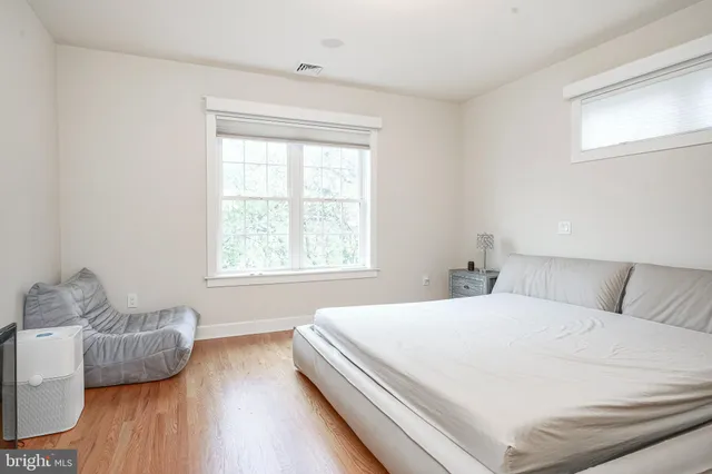 a bedroom with bed and window